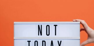 Canva Not Today Covid19 Sign On Wooden Stool scaled